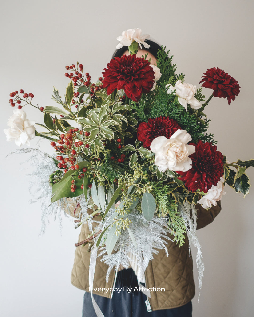 hand-tied bouquet with winter foliage
