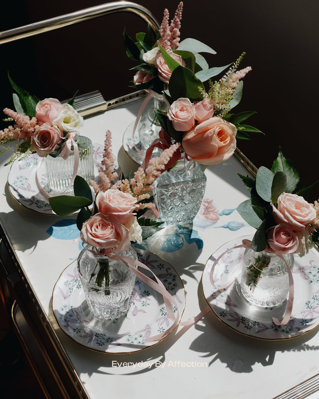 boutonniere in pink roses placed in glass