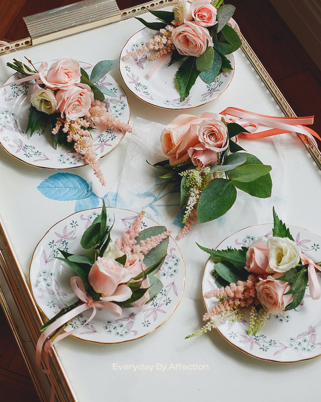 button holes in pink roses and green leaves 