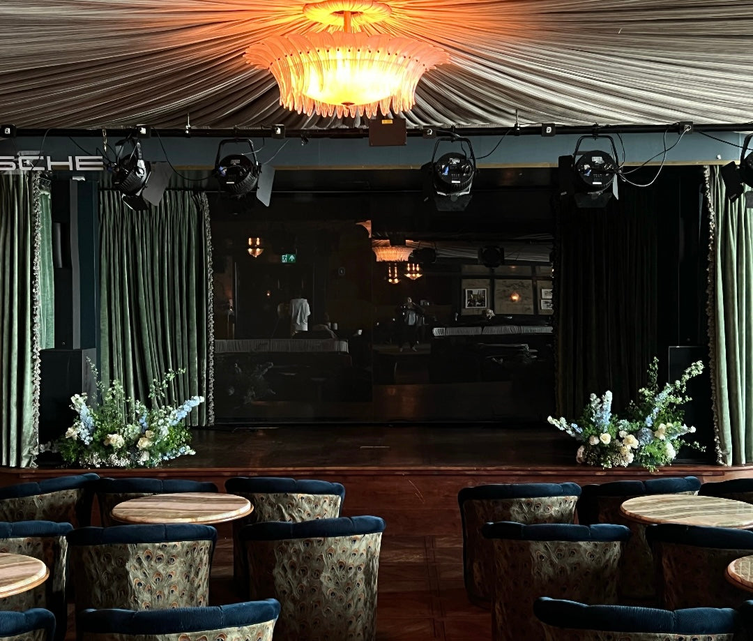 flowers on a stage in a hotel club