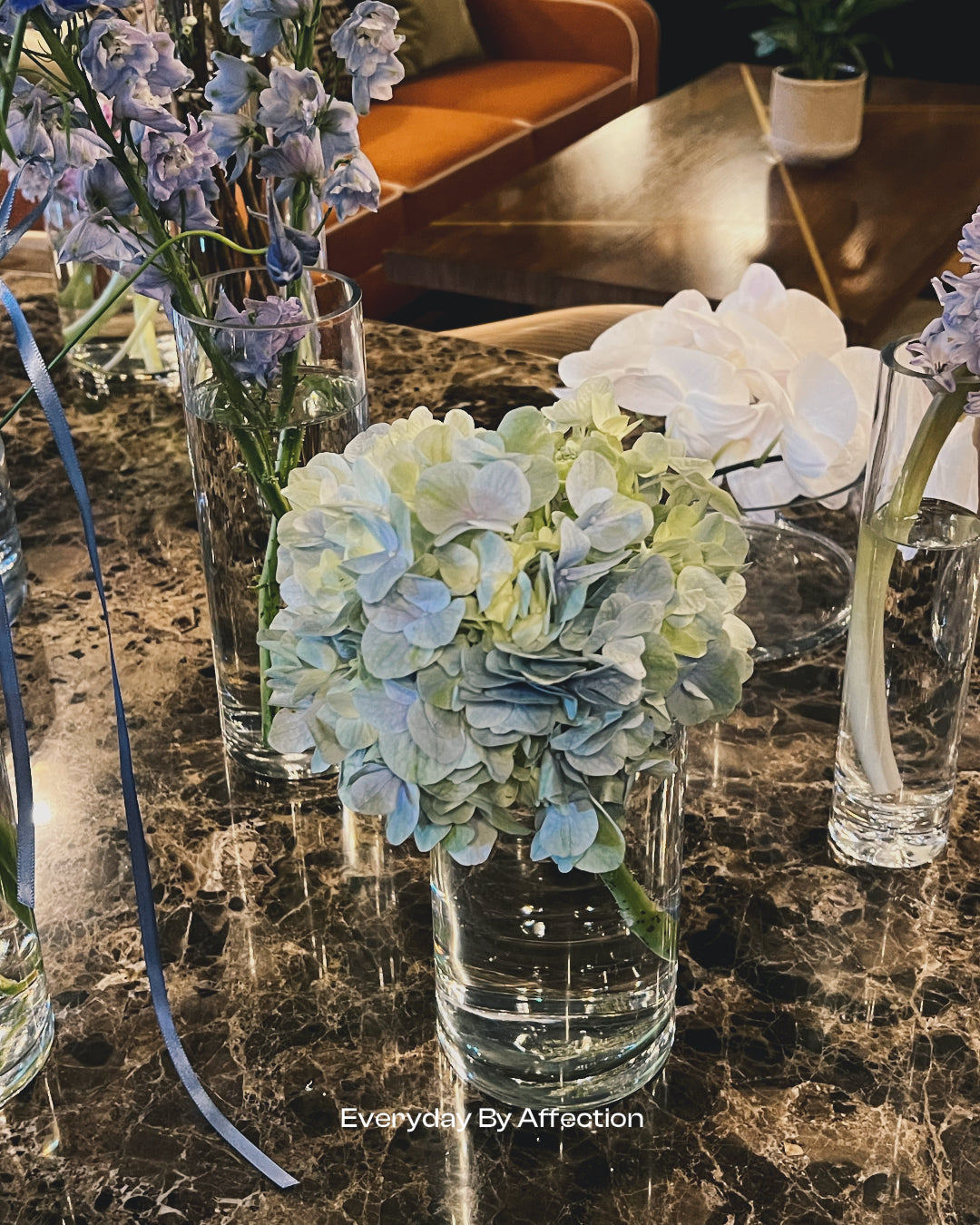 bubble gum blue hydrangea in glass vase