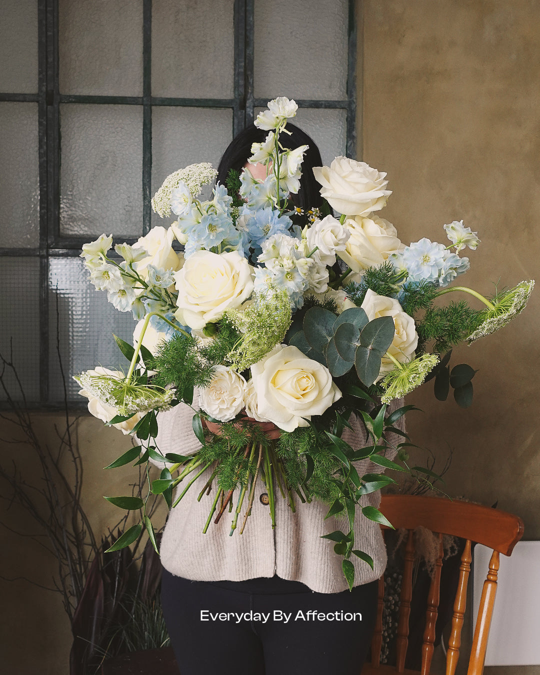 luxury handtied bouquet in white roses queen anne's lace and eucalyptus