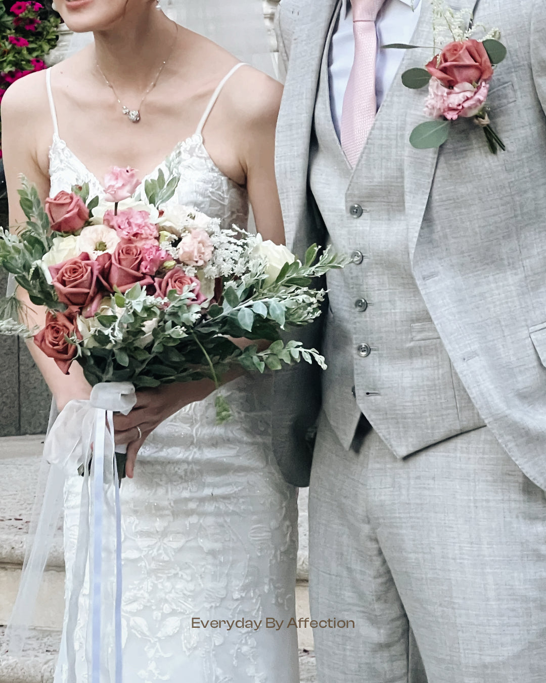 bride and groom with pink rose bouquet and buttonhole